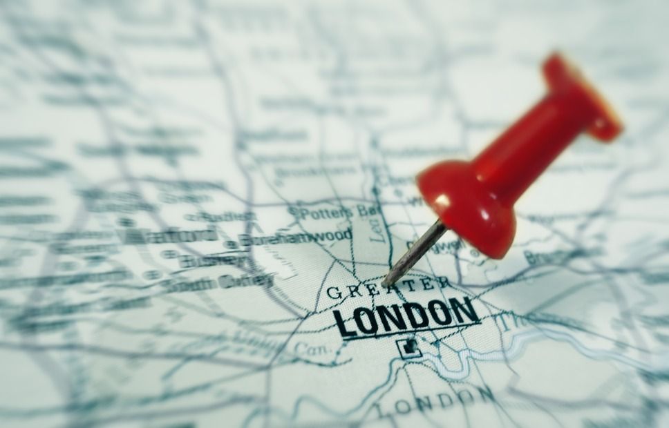 closeup of a map with London with red pin